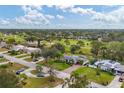 Aerial view showcasing a house and surrounding landscape at 5006 W Country Club Dr, Sarasota, FL 34243