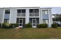 Condo building with screened porch and lawn at 5310 26Th W St # 501, Bradenton, FL 34207