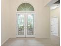 Bright entryway with double doors and hardwood floors at 6234 Sturbridge Ct, Sarasota, FL 34238