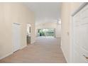 Hallway view of living area with sliding doors to lanai at 6234 Sturbridge Ct, Sarasota, FL 34238