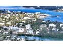 Aerial view of waterfront home with surrounding neighborhood at 625 Jackson Way, Longboat Key, FL 34228