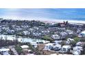 Aerial view of a waterfront home and community at 625 Jackson Way, Longboat Key, FL 34228