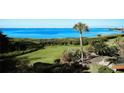 Stunning view of the bay from a condo with lush landscaping at 6440 Mourning Dove Dr # 101, Bradenton, FL 34210