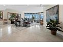 Spacious living room with ocean views and tile floors at 675 Longboat Club Rd # 22A, Longboat Key, FL 34228