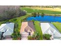 Bird's-eye view showcasing a single-story house with a backyard and golf course views at 8752 Monterey Bay Loop, Bradenton, FL 34212