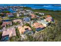 Bird's eye view of a house with a pool in a residential area at 12317 Baypointe Ter, Cortez, FL 34215
