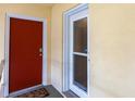 Condo entry with red door and a secondary glass door at 145 Avenida Messina # 3, Sarasota, FL 34242