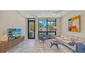 Bright living room with comfy seating and large windows at 1762 10Th St, Sarasota, FL 34236