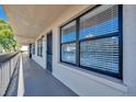 Condo hallway with access to individual units and a balcony at 435 30Th W Ave # D309, Bradenton, FL 34205