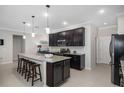 Modern kitchen with granite countertops and stainless steel appliances at 4506 Lindever Ln, Palmetto, FL 34221