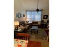 Living room with brown couch and coffee table at 4802 51St W St # 1106, Bradenton, FL 34210