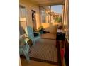 Screened porch with seating and potted plants at 4802 51St W St # 1106, Bradenton, FL 34210