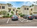 Condo building with ample parking spaces for residents at 5128 Marsh Field Ln # 129, Sarasota, FL 34235