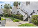 Condo building exterior with walkway and lush landscaping at 542 Lakeside Dr # 542, Bradenton, FL 34210