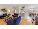 Living room, kitchen, and dining area with open floor plan at 5839 Helicon Pl, Sarasota, FL 34238