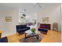 Open concept living room with view into adjacent kitchen and dining area at 5839 Helicon Pl, Sarasota, FL 34238
