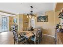 Casual dining area with a rustic table and coastal-themed decor at 6065 Worsham Ln # 104, Bradenton, FL 34211