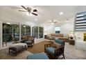 Bright living room with comfy seating, large windows, and access to a balcony at 6250 Holmes Blvd # 71, Holmes Beach, FL 34217