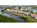 Aerial view of waterfront condos, emphasizing a specific unit's location and water access at 8644 54Th W Ave # 8644, Bradenton, FL 34210