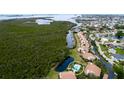 Aerial view showcasing condo community with waterfront access and swimming pool at 8644 54Th W Ave # 8644, Bradenton, FL 34210