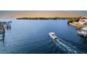 Aerial view of a boat cruising on calm waters at 1215 Acappella Ln, Apollo Beach, FL 33572