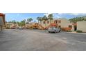 Exterior view of building and parking lot with cars at 153 Wild Palm Dr # 153, Bradenton, FL 34210