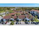 Aerial view of a large community of homes with ample parking at 1618 Stickney Point Rd # 1618-202, Sarasota, FL 34231