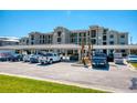 Exterior view of a modern apartment building with parking at 17520 Gawthrop Dr # 102, Bradenton, FL 34211