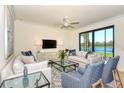 Spacious living room with lake views and modern furniture at 17520 Gawthrop Dr # 102, Bradenton, FL 34211
