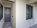 Private condo entry with dark gray door and neutral-colored walls at 17724 Gawthrop # 103, Bradenton, FL 34211