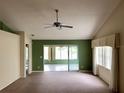 Living room with a view of the sunroom and access to other areas at 1803 Ashley Dr, Venice, FL 34292