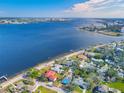 Aerial view showcasing waterfront property and surrounding houses at 2425 Riverview Blvd, Bradenton, FL 34205