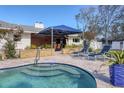 Relaxing pool and spa with a covered patio area at 2425 Riverview Blvd, Bradenton, FL 34205