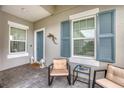 Relaxing front porch with blue shutters and comfortable seating at 2616 Sapphire Blue Ln, Bradenton, FL 34211