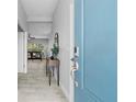Bright entryway with light tile floors and a view into the living room at 3543 Woodmont Dr, Parrish, FL 34219