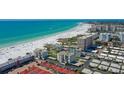 Aerial view of beachfront community and ocean at 6144 Midnight Pass Rd # 2N, Sarasota, FL 34242