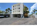 Covered parking spaces in front of building at 6144 Midnight Pass Rd # 2N, Sarasota, FL 34242