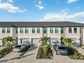 Aerial of townhouses showcasing the community's layout and landscaping at 6404 Silverstar Dr, Sarasota, FL 34240