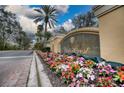 Watercrest community entrance with colorful flowers at 6450 Watercrest Way # 303, Lakewood Ranch, FL 34202