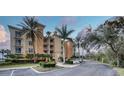 Building exterior with palm trees and parking at 6450 Watercrest Way # 303, Lakewood Ranch, FL 34202