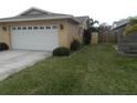 Attached garage with double doors and ample space for parking at 9400 Ridge Rd, Seminole, FL 33772