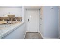 Interior entryway with tile floor and access to kitchen at 9481 Highland Oak Dr # 1403, Tampa, FL 33647