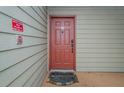 Condo building entry door with a welcome mat at 9481 Highland Oak Dr # 1403, Tampa, FL 33647