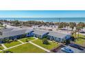 Aerial view of beachside property, showing building and ocean at 100 The Esplanade N # 1, Venice, FL 34285