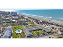 Aerial view of community near the beach with pool at 100 The Esplanade N # 1, Venice, FL 34285