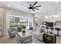Spacious living room with a view of the pool and golf course at 10114 Glenmore Ave, Bradenton, FL 34202