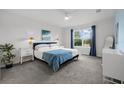Spacious bedroom with large window, plush bed, and ample natural light at 11628 Middle Fork Way, Parrish, FL 34219