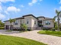 Single-Gathering home with a two-car garage and landscaped yard at 12334 Baypointe Ter, Cortez, FL 34215