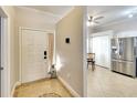 Bright entryway with tile flooring and a view into the kitchen at 12732 Rockrose Gln, Lakewood Ranch, FL 34202