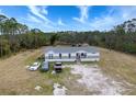 Aerial view of a manufactured home with a large yard at 14150 Manatee Rd, Parrish, FL 34219